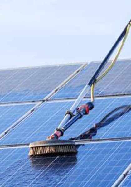Professional solar panel cleaning service in progress